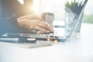Business woman working on laptop at the office, online social media networking
