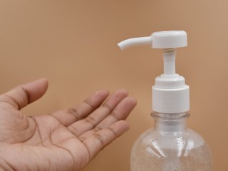 Hand with alcohol gel for protection against viruses Covid-19