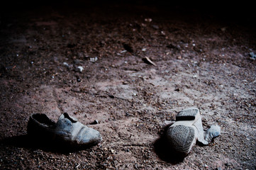 Lost child shoes on a dirty floor - obrazy, fototapety, plakaty