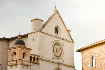 Fototapeta na wymiar Assisi, Italy. Just arrived in this little town from a pilgrimage on the Saint Francis way, the view of the church dedicated to the saint indicates the end of the trip and the time to rest