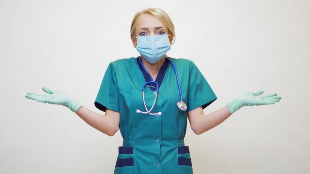 medical doctor nurse woman wearing protective mask and latex gloves - lack of mind gesture