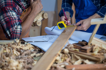 Professional carpenters are teaching carpentry to a new generation.