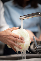 Picture of washing vegetables with water in the kitchen