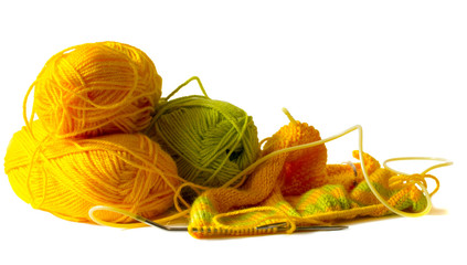Photo illustration on knitting and needlework. The image is isolated on a white background. Yarn, knitting needles.