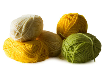 Photo illustration on knitting and needlework. The image is isolated on a white background. Yarn, knitting needles.