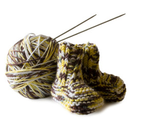 Photo illustration on knitting and needlework. The image is isolated on a white background. Yarn, knitting needles.