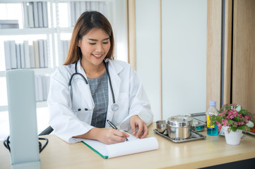 Female doctors work in the examination room of the hospital.