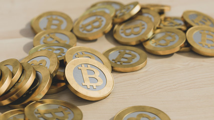 golden bitcoin coins on a wooden table