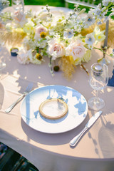 Table setting at a luxury wedding and Beautiful flowers on the table.