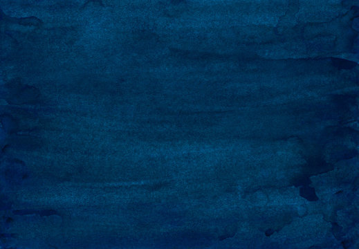 Watercolor dark indigo blue background painting. Vintage deep blue color hand painted watercolour backdrop. Stains on paper texture.