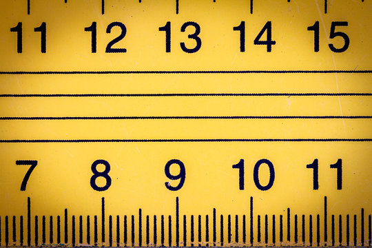 Yellow metal ruler close up