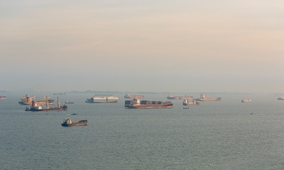 Cargo ships and oil tankers anchored offshore along the Singapore Straight, in Singapore