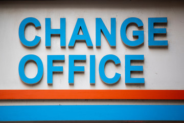 Signpost in blue white colors belonging to the exchange office. Close up.