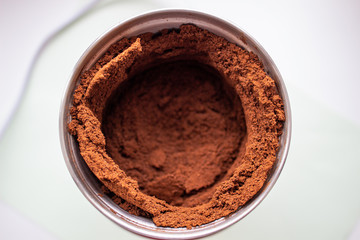 Ground coffee in a coffee grinder