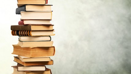Collection stack of old retro books on background