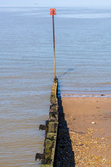 A view of pebble beach and seafront, Whitstable Seafront, Kent, UK