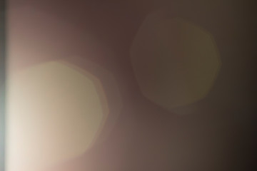 Lens flare and light leak haze texture on a black background.