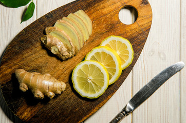 Sliced slices of lemons and ginger. Prevention of colds and viruses. Organic medicine
