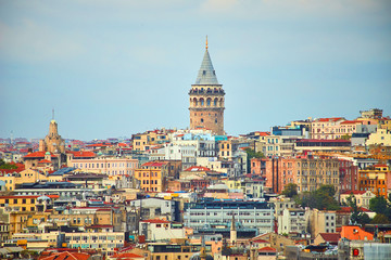 Fototapeta na wymiar Istanbul cityscape in Turkey with Galata Kulesi Tower. Ancient Turkish famous landmark in Beyoglu district, European side of city. Architecture of the Constantinople.Historical place made by Genoese