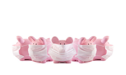 Group of pink piggy banks with protective medical masks on white background. Banking during a pandemic concept.