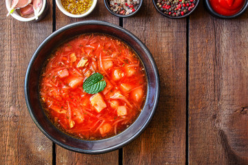 red tomato soup and vegetables and meat, borsch cuisine menu concept keto or paleo diet background. top view. copy space for text