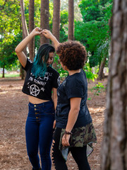 Lesbian girlfriends kissing in the park