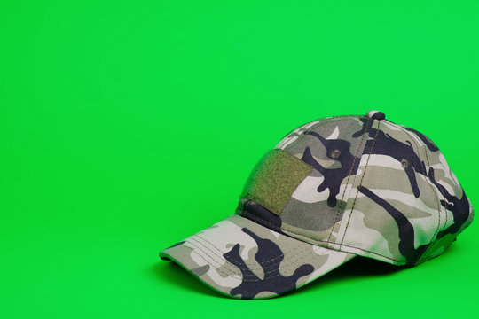 Khaki Camouflage Military Cap On Green Background