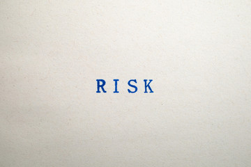 a RISK word stamped on a piece of paper.