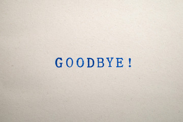 a GOODBYE! word stamped on a piece of paper.