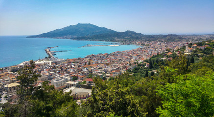 Fototapeta na wymiar Zakyntos city and port from top panorama view, with the blue sky, sea, and mountain in background