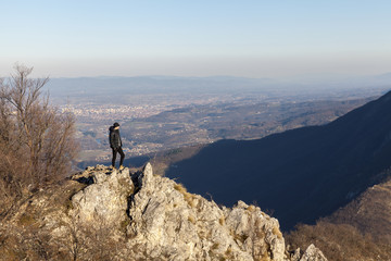  man at the top of a mountain