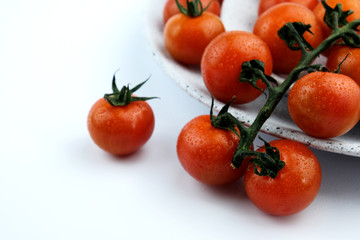 small cherry tomatoes on a white background