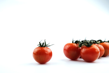 small cherry tomatoes on a white background