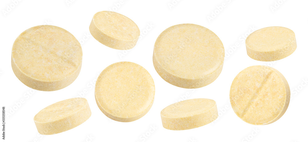 Wall mural yellow textured pills isolated on white