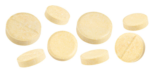 Fototapeta na wymiar yellow textured pills isolated on white