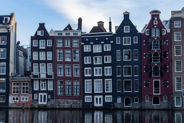 Colourful architecture in the centre of Amsterdam by the canal 