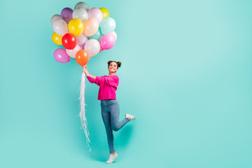 Fototapeta na wymiar Full length body size view of nice attractive dreamy cheerful cheery wavy-haired girl holding in hand air balls having fun isolated on bright vivid shine vibrant green blue color background