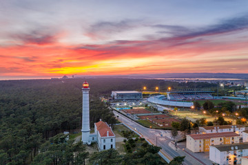 Aerial drone view of Vila Real de Santo Antonio city, lighthouse farol and stadium in Portugal, at...