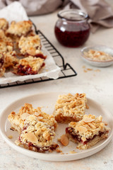 Pie bars with berry jam, spices and crumble