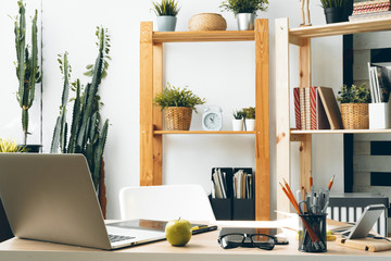 Stylish office table desk. Workspace with laptop. Close up.