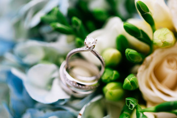 wedding rings and flowers