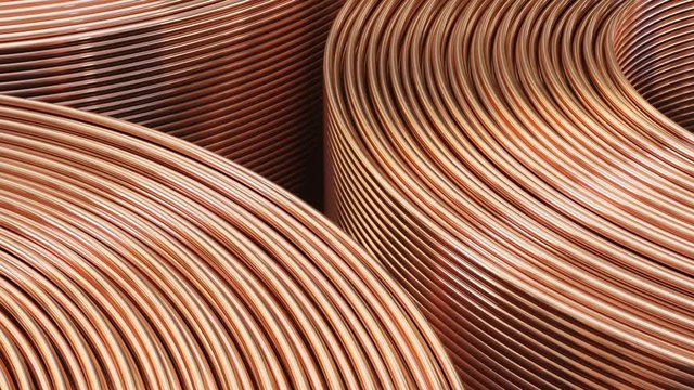 Copper pipes close-up. Coils with tubes in warehouse.