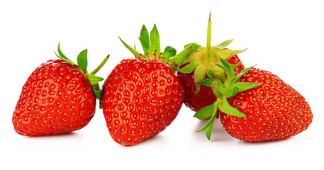 Strawberries with leaves isolated on a white background.