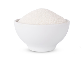 Sugar in glass bowl isolated on white background