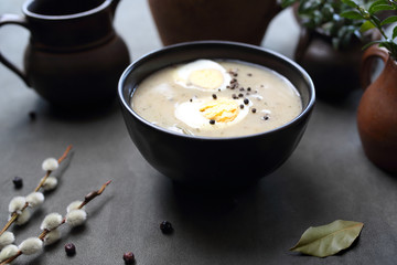 Sour rye soup with egg. Traditional Easter dish. Traditional Easter dishes, serving suggestions,...
