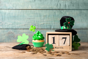 Composition with block calendar on wooden table. St. Patrick's Day celebration