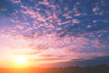 Colorful cloudy sky at sunset. Gradient color. Sky texture, abstract nature background