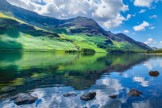 Mountains reflected on a lake at the beautiful Lake District in England