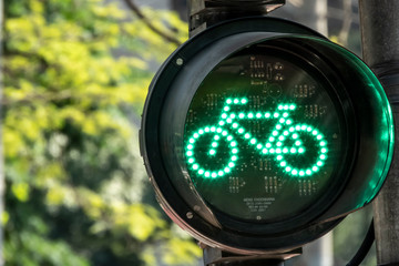 Green bicycle semaphote in downtown Sao Paulo