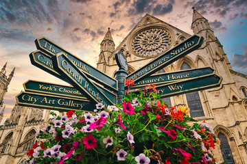 The York Minster and a sign with directions to landmarks in the city